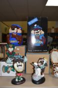 A selection of Warner Bros Taz collectables, including Cookie jar and three figures.