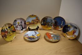 Eight Looney tunes collectors plates, including Buggs Bunny and Daffy.