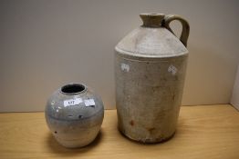 A large vintage stoneware flagon and a primitive glazed stoneware vase, AF.