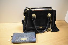 A BIBA purse in iridescent blue snakeskin effect fabric and a BIBA handbag in black leather and