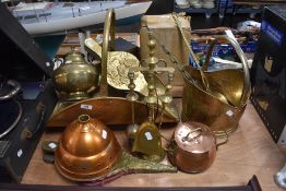 A variety of vintage brass and copper items, including; log basket, companion set, bellows, coal