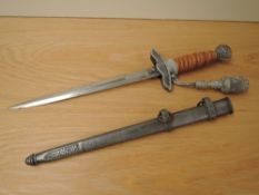 A German Third Reich Officers Dress Dagger by Eickhorn, metal scabbard, portepee knot, blade