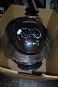 An electric stand alone cooking pot.