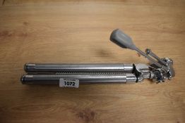 A small Vivo chrome tripod