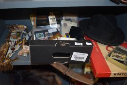 A miscellaneous selection of items including a small amount of stamps and postcards, a sword and a