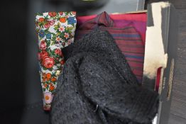 Four vintage dresses comprising a 1960s black wool shift dress with Paris label, a 1960s striped