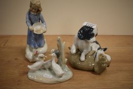 A Royal Doulton figurine, Country Girl and two Nao studies of puppies and geese.