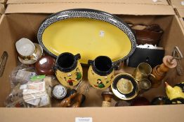 An assortment of items including a large oval footed dish having black decoration, a small
