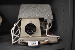 A boxed Aldis 303 slide projector