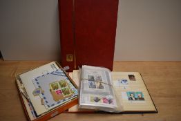 A small collection of stamps including albums