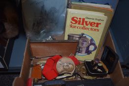 A small selection of books including Britain's Wonderful Air Force, a small metal box and a