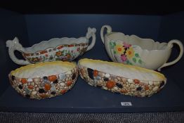 Four flower troughs, a Crown Devon A529L/S floral with cream background, a Delft's hand made for