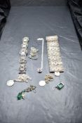 A selection of silver and white metal jewellery including broad seven panel filigree bracelet