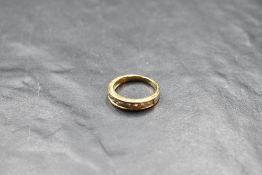 A nine stone diamond half eternity ring, total approx 0.75ct in a channel setting on an 18ct