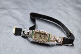 An Art Deco platinum and diamond set cocktail watch having Arabic numeral dial to rectangular face