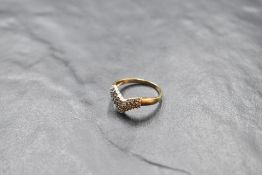 A triple row diamond wishbone ring having 33 stones, total approx 0.5ct on a 9ct gold loop, size P &