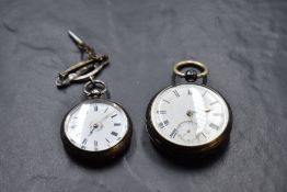 Two silver key wound pocket watches, both having Roman numeral dials