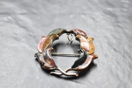 A Victorian Scottish mixed agate and silver brooch having a silver back