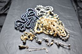 A selection of costume simulated pearl jewellery including brooch, necklaces, pendant, earrings etc