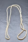 A long string of small pearls, approx 60'