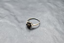 A small sapphire and diamond daisy cluster ring on a 9ct white gold loop, size L & approx 1.2g