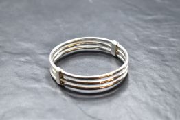 A triple bar continental silver bangle