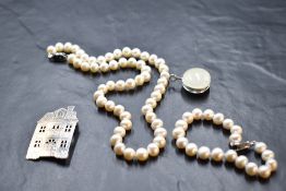 A string of baroque pearls with matching bracelet, both having clasps stamped 925, a polished