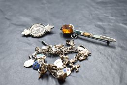 A 1960's Scottish silver brooch in the form of a sword with inset agate panels, a white metal