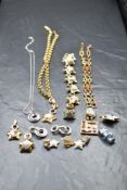 A selection of Swarovski jewellery including swan brooch, moon and stars set, leaf brooch with