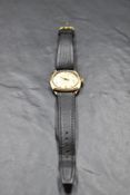 A gent's vintage 9ct rose gold wrist watch by Helvetia having baton and Arabic numeral dial in plain
