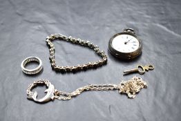 A small selection of silver jewellery including a dolphin pendant with chain, small key wound fob
