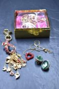 Four pieces of Wilson & Butler jewellery including heart necklace, 40th Anniversary keyring, clip