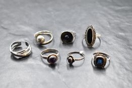 Seven silver and white metal rings of various forms including modernist, amethyst, marcasite etc