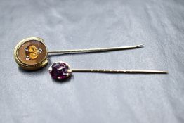A Victorian reverse painted fox mask pin in an unmarked oval yellow metal mount and pin, and an
