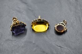 Two 9ct rose gold watch fobs having yellow paste stone and collared bloodstone and carnelian stones,