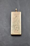 A 9ct gold ingot pendant bearing oversized 1977 hallmarks, approx 30.2g