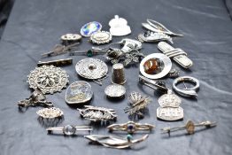 A selection of silver and white metal brooches, many stamped 925/sterling including ARP,