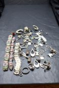 A small jewellery case containing a selection of silver and white metal jewellery including