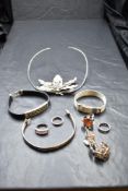 A small selection of silver and white metal jewellery including a Thai Karen Silver leaf pendant,