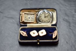 A pair of 9ct rose gold cufflinks having diamond chip set fronts with lozenge backs and chain