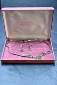 A silver and faux black opal articulated necklace having five opal panels with fixed oblong link
