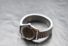 A gent's 1940's steel Omega wrist watch having wind up mechanism, Arabic numeral dial and subsidiary