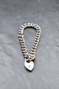 A silver curb link bracelet with padlock clasp, approx 26g