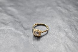 A cubic zirconia halo ring on a 9ct gold loop, size M & approx 2.1g