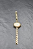 A lady's vintage 9ct gold wrist watch by Limit having Arabic numeral dial to circular face in