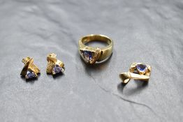 A yellow metal suite of jewellery stamped 14K comprising of stud earrings, ring and pendant, all