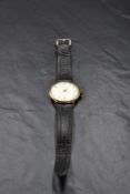 A gent's 1960's 9ct gold manual wrist watch by Smiths Astral having Arabic numeral dial in plain
