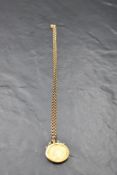 A Victorian shield back 1853 gold sovereign in a yellow metal removable pendant mount on a 9ct
