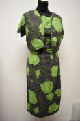 A 1950s abstract rose print dress and bolero jacket, dress having gathers to hip and bow detail