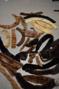 A large collection of vintage and antique fur tippets, collars and trimmings, some unlined,